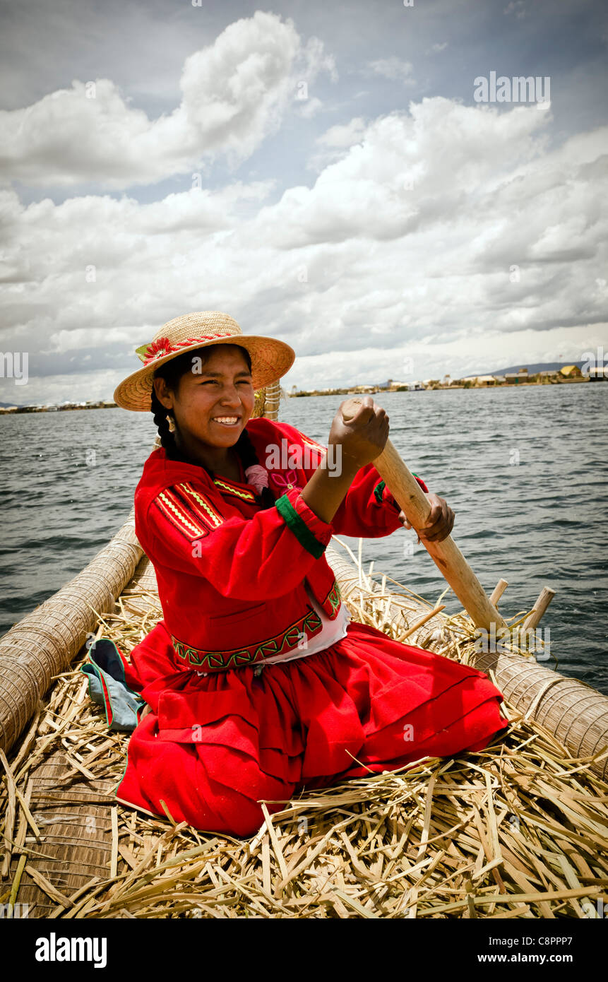 Young girl wearing traditional costume from Uros Islands Titicaca Lake Puno region Peru Stock Photo