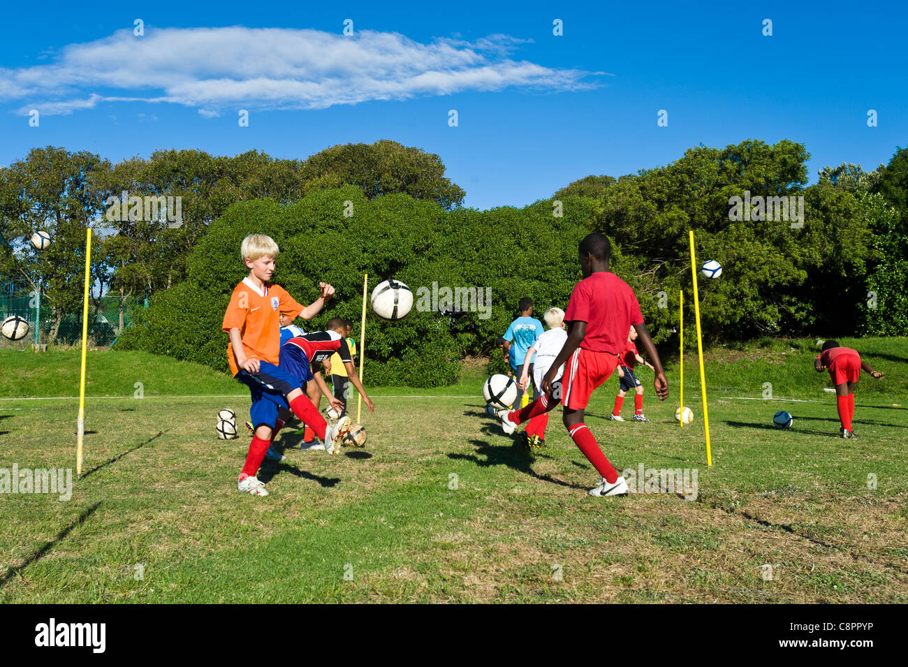 Junior football players practicing ball skills Cape Town South Africa Stock Photo