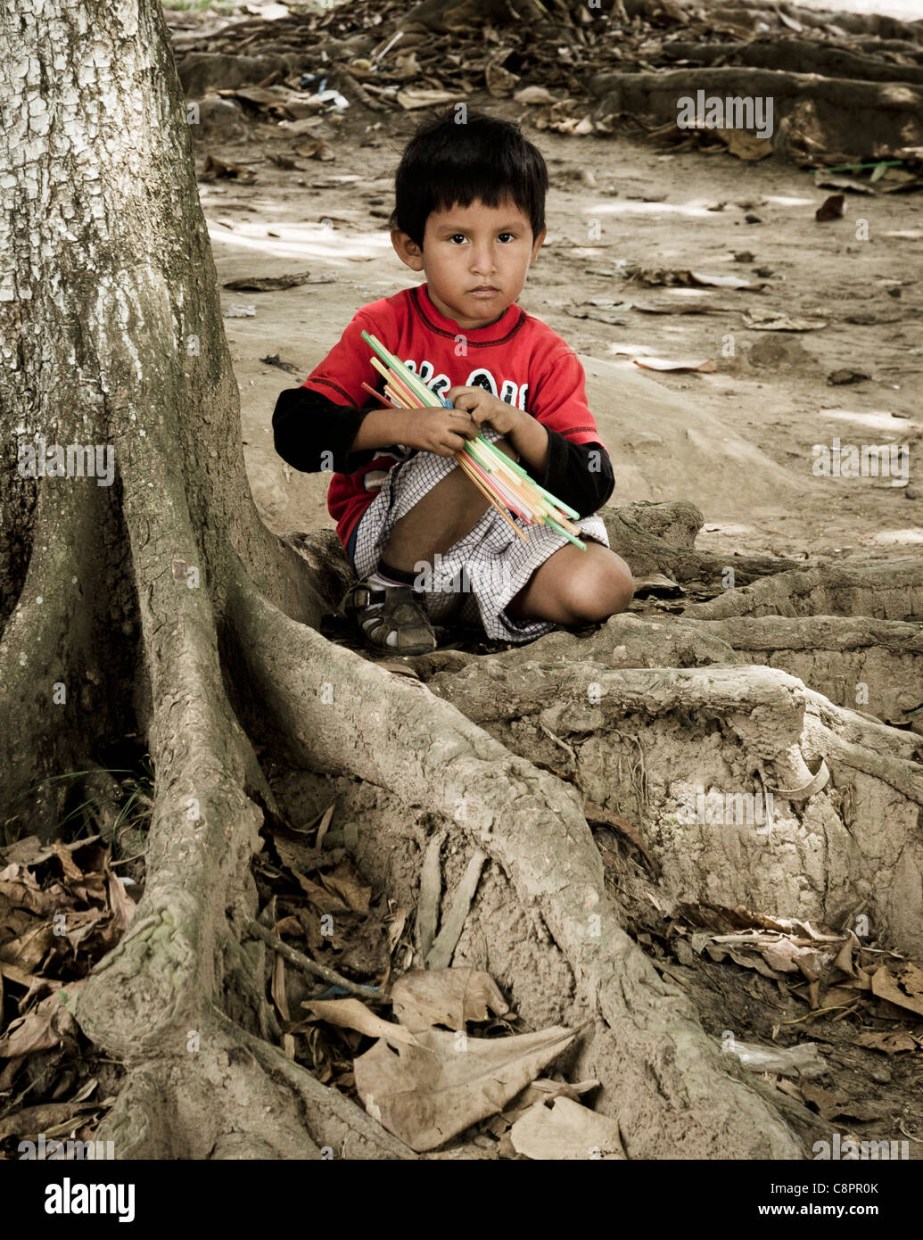 Young boy playing Tambopata National Reserve Puerto Maldonado Amazon Area Peru Stock Photo