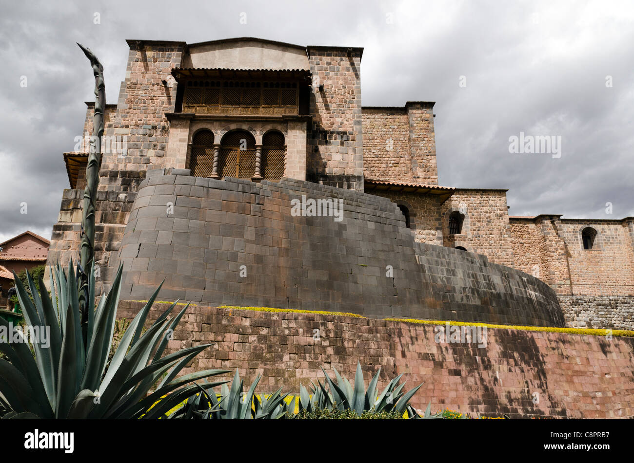 Santo Domingo convent with Inca curve wall built on top of the Inca Temple of the Sun Cusco Peru Stock Photo