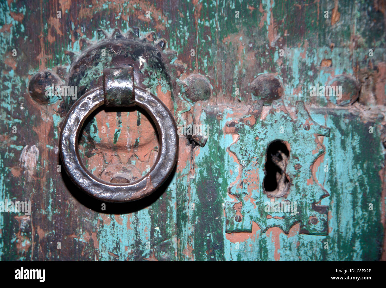Traditional iron hand-ring on a doorway in Marrakesh medina, Morocco Stock Photo