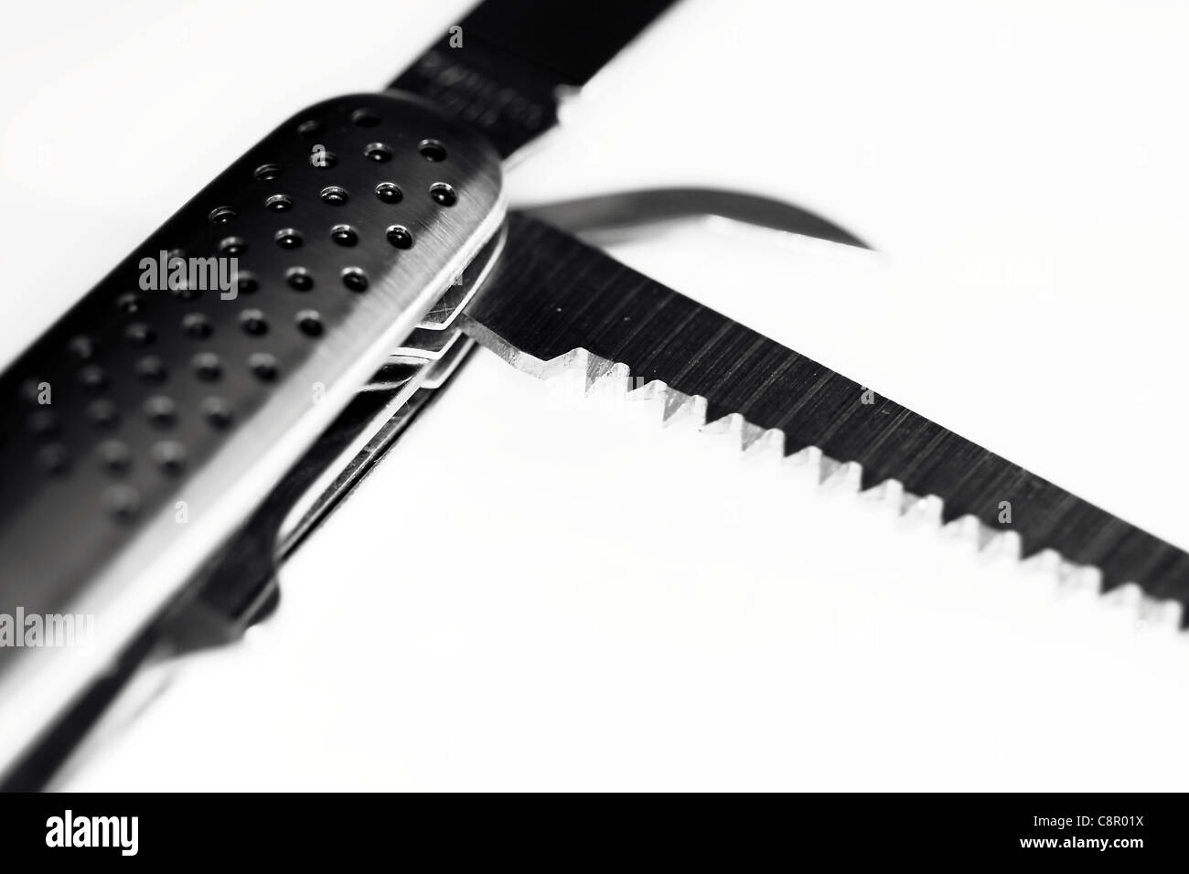 saw blade folding knife Stock Photo