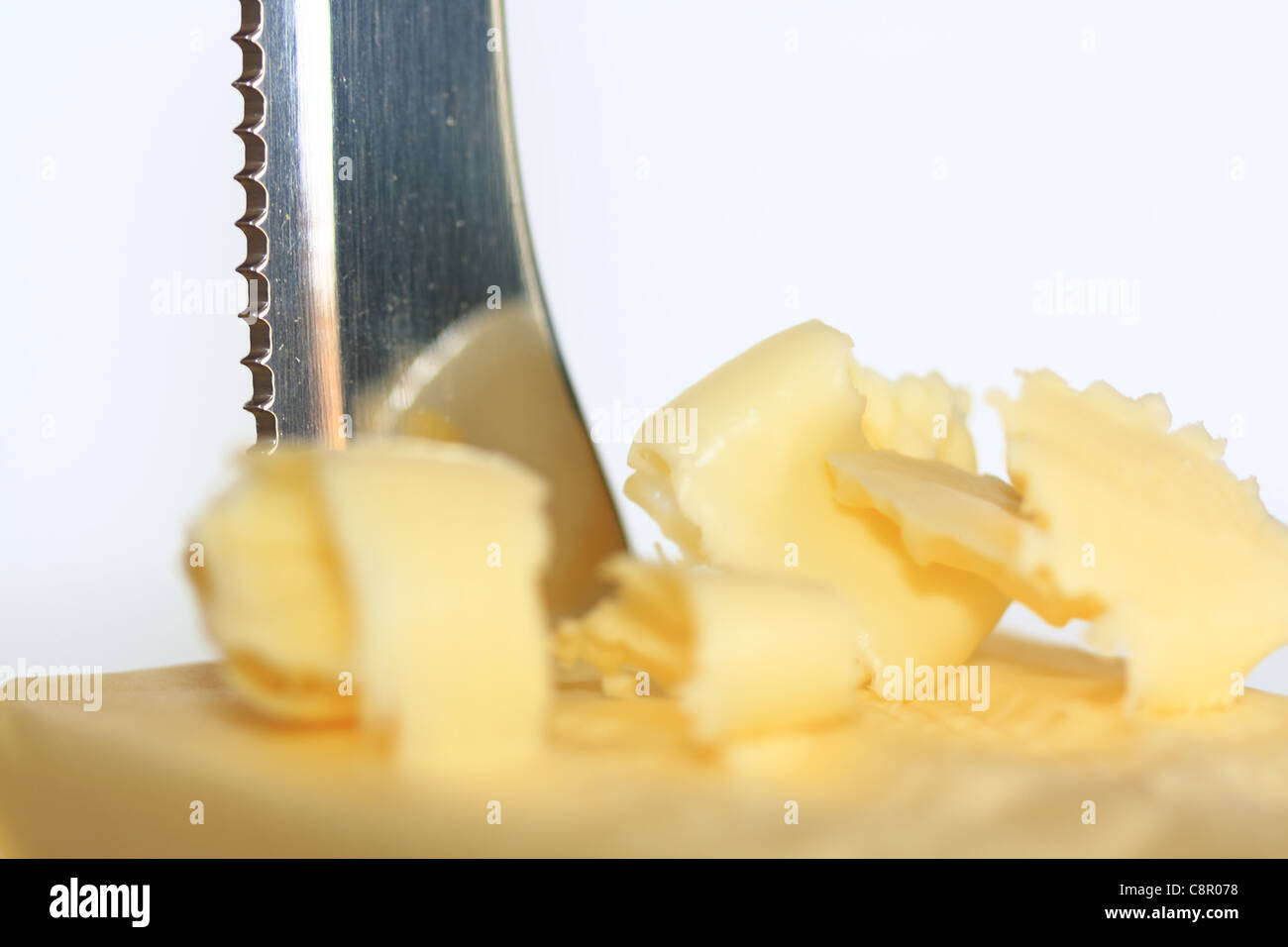 Delicate string butter with knife Stock Photo
