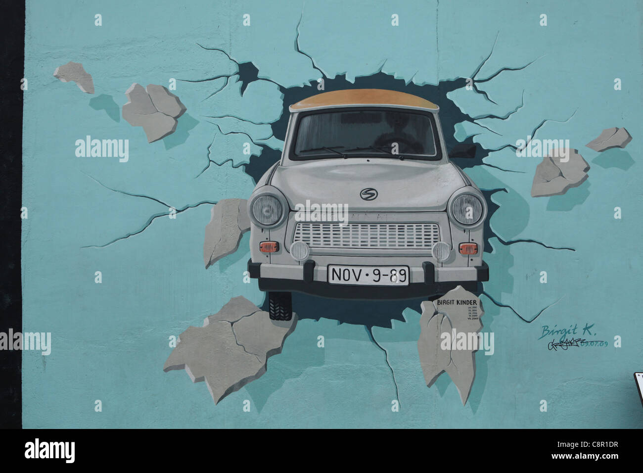 Trabant breaking through the wall pictured on the Berlin Wall in East Side Gallery in Berlin, Germany. Stock Photo