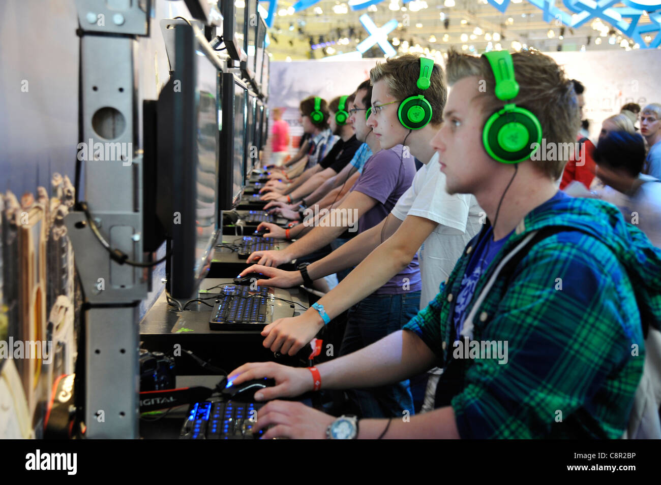 male teenagers play Computer role-playing game at the gamescom convention in Cologne, Germany Stock Photo