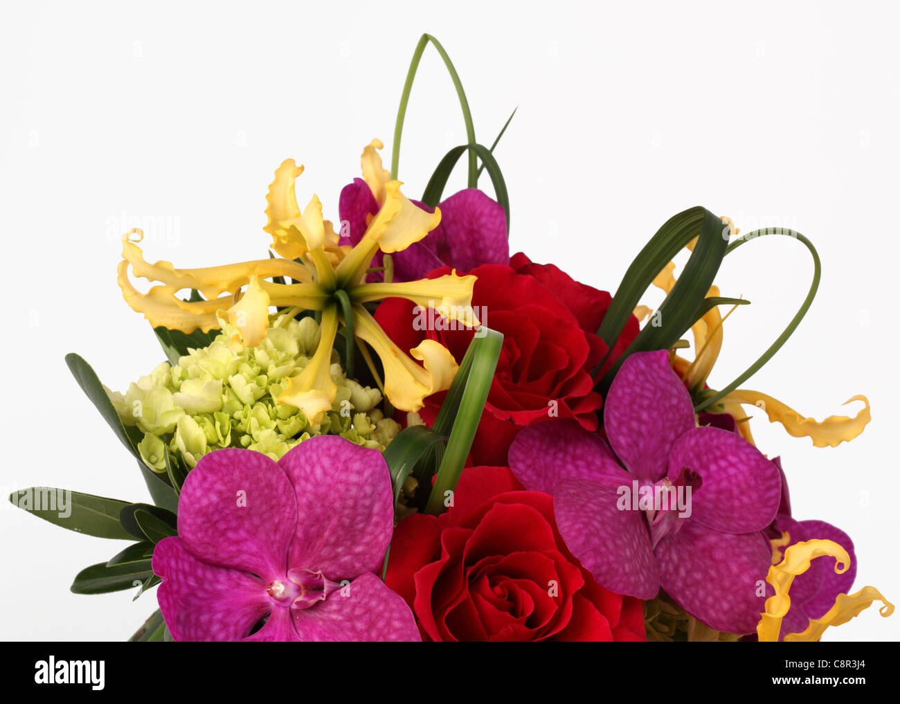 A close-up of a colorful bouquet of flowers. Red roses, cream hydrangea, yellow orchid [Laelia], purple orchid [Vanda] Stock Photo