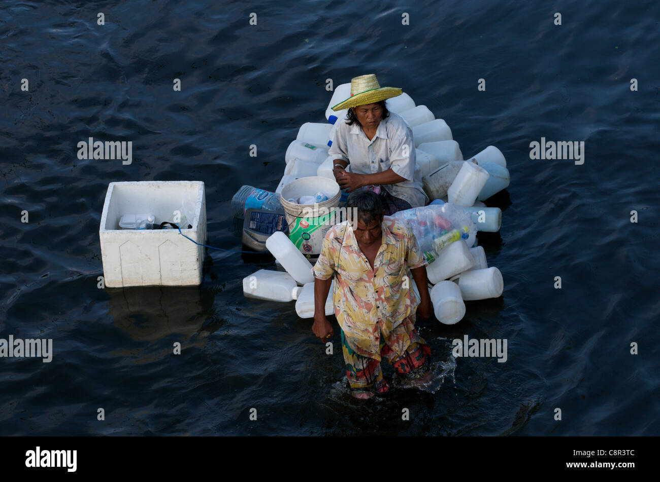 Thai refugees flee flooding on makeshift raft, Phahon Yothin Road, Bangkok, Thailand on Monday, October 31st, 2011. Thailand is experiencing its worst flooding in more than 50 years. Credit Line: Kraig Lieb / Alamy Live News. Stock Photo