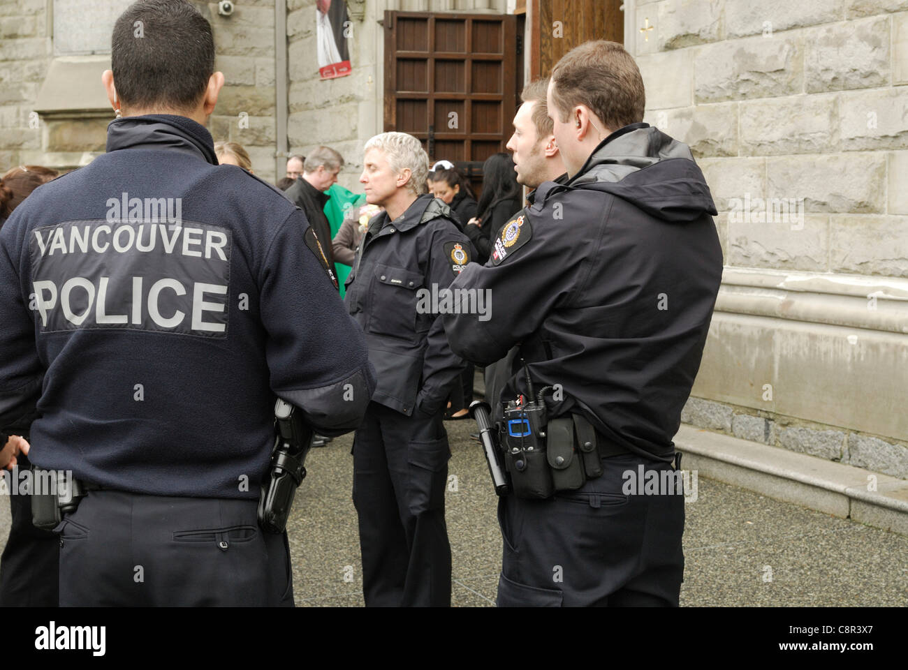 In anticipation of a  protest, Vancouver Police wait at The Holy Rosary Cathedral. Vancouver City - October 30 2011 Stock Photo