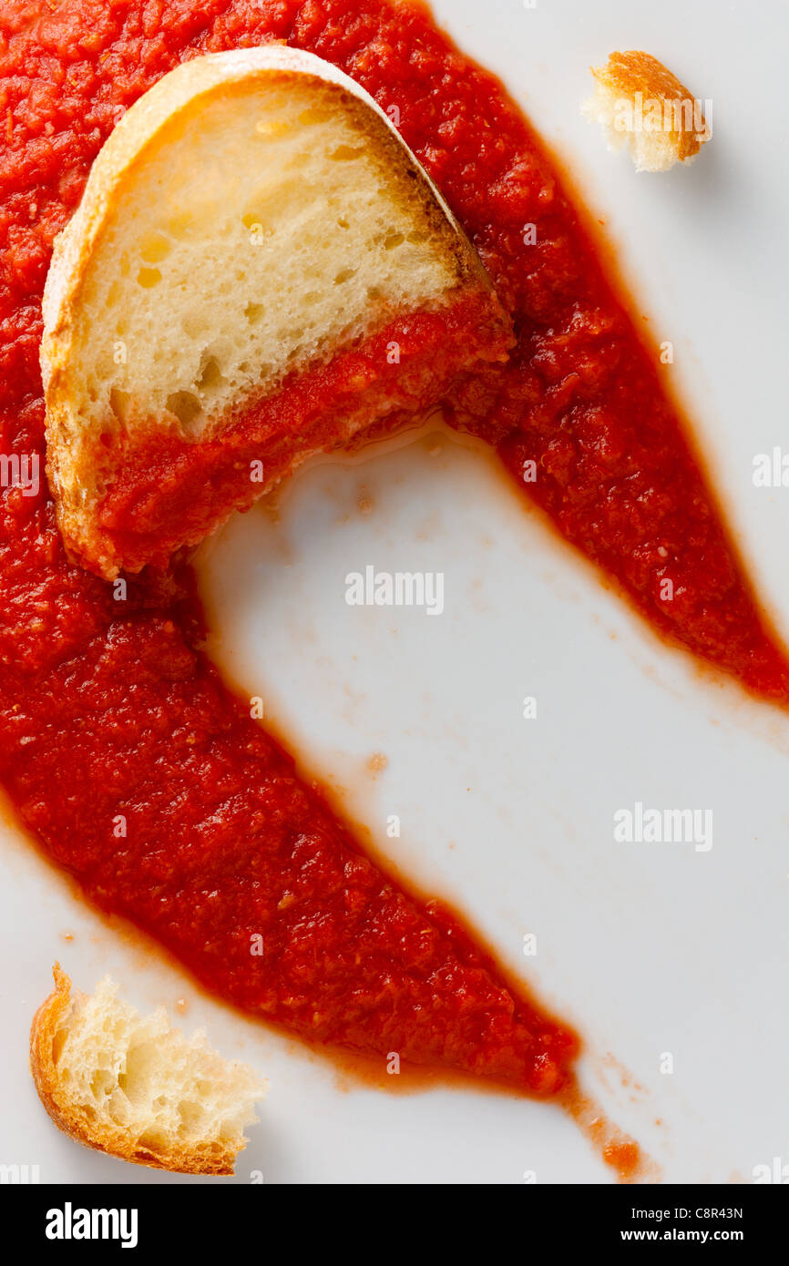 Scarpetta - an Italian Habit, Cleaning a Dish from Tomato Sauce Using Bread Stock Photo