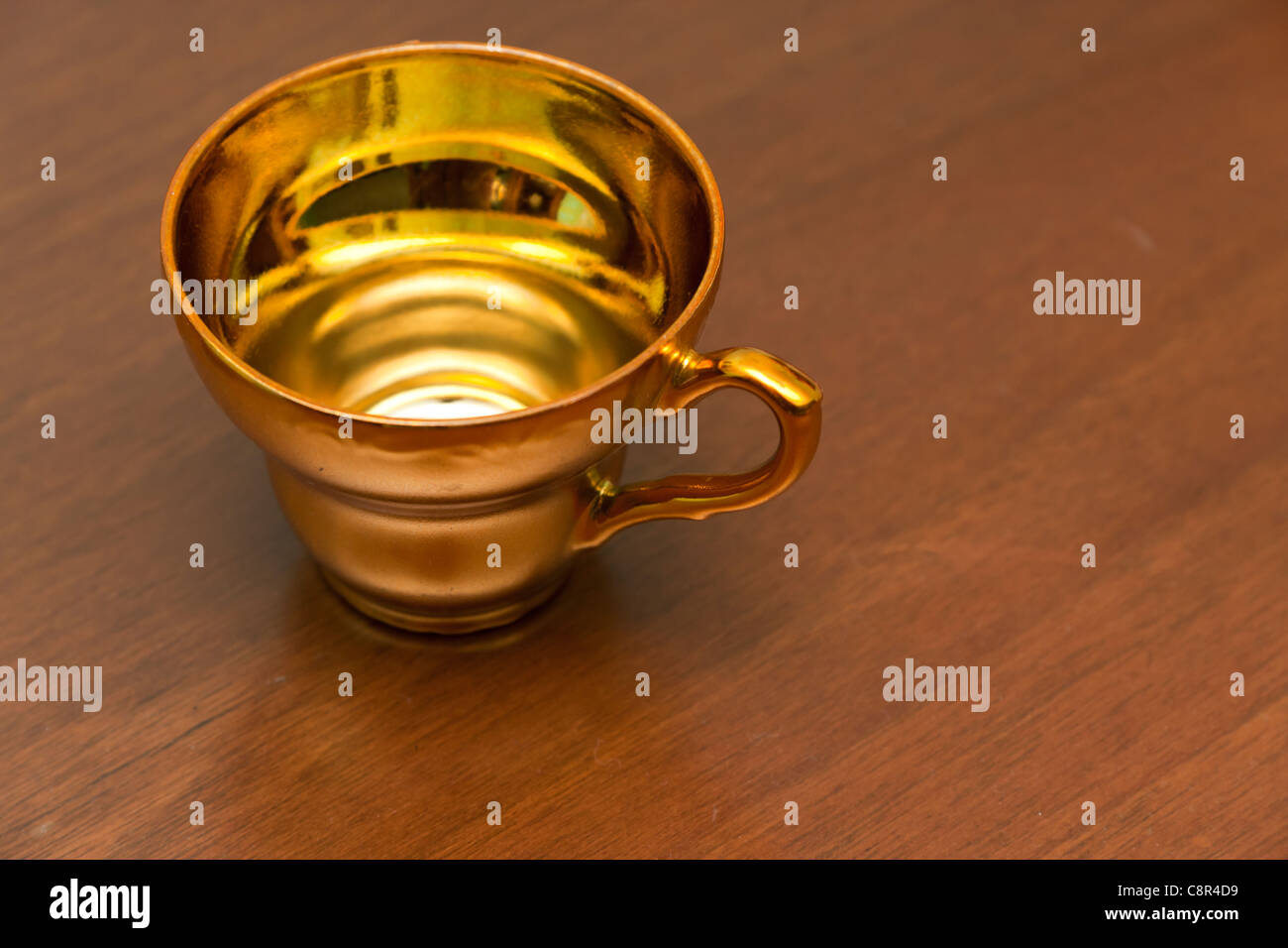Golden coffee cup Stock Photo Alamy