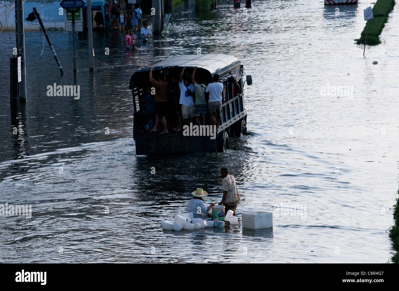 Bangkok residents flee flooding on Phahon Yothin Road, Bangkok, Thailand on Monday, October 31st, 2011. Thailand is experiencing its worst flooding in more than 50 years. Stock Photo