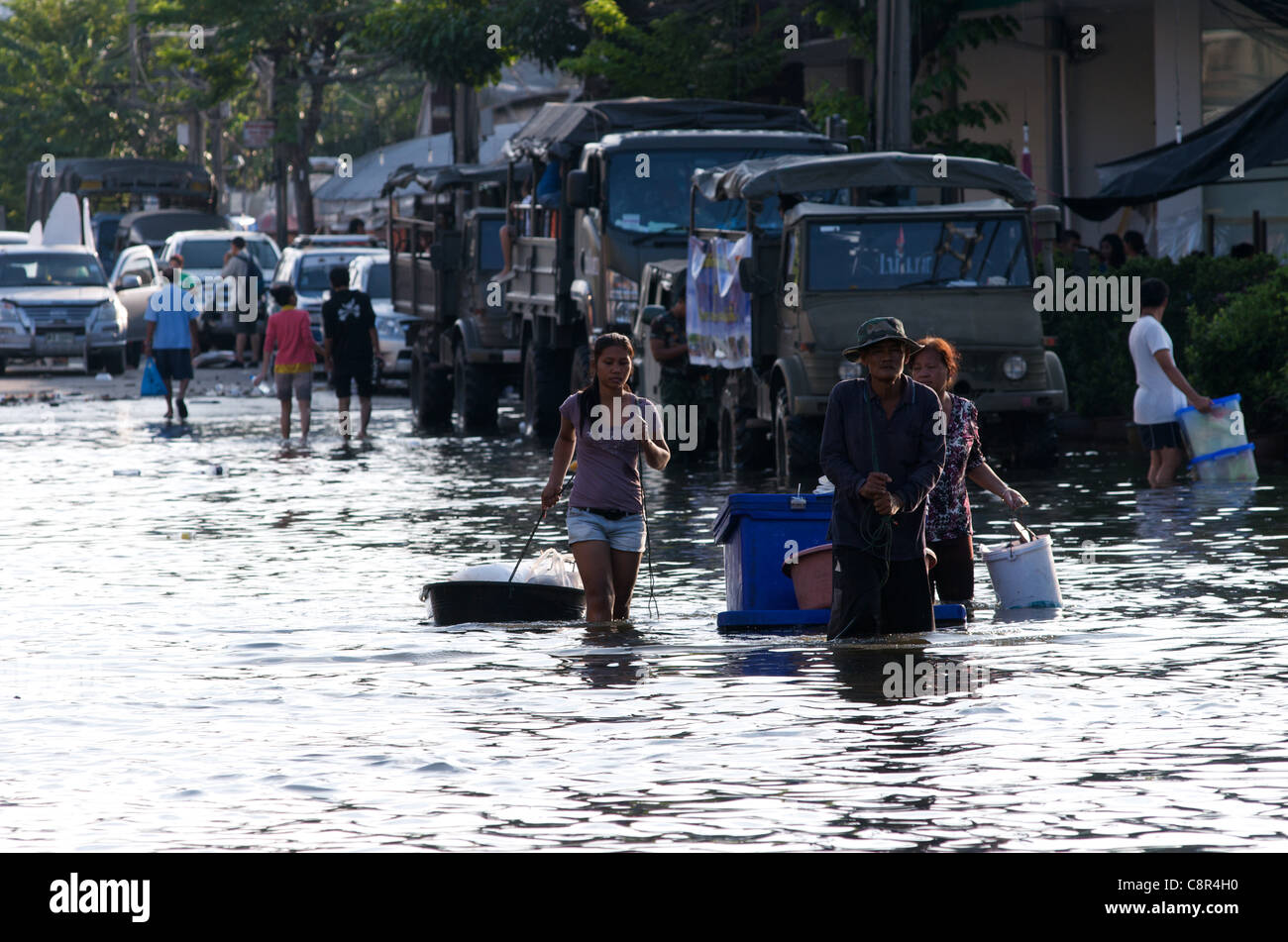 Thai refugees wade through flooding, Phahon Yothin Road, Bangkok, Thailand on Monday, October 31st, 2011. Thailand is experiencing its worst flooding in more than 50 years. credit: Kraig Lieb Stock Photo