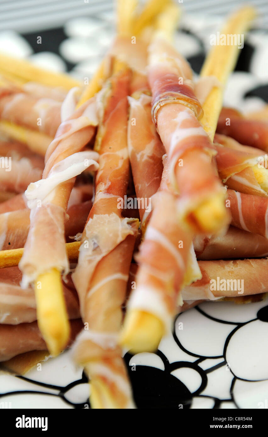 Breadsticks wrapped in Parma ham on a Missoni plate Stock Photo Alamy