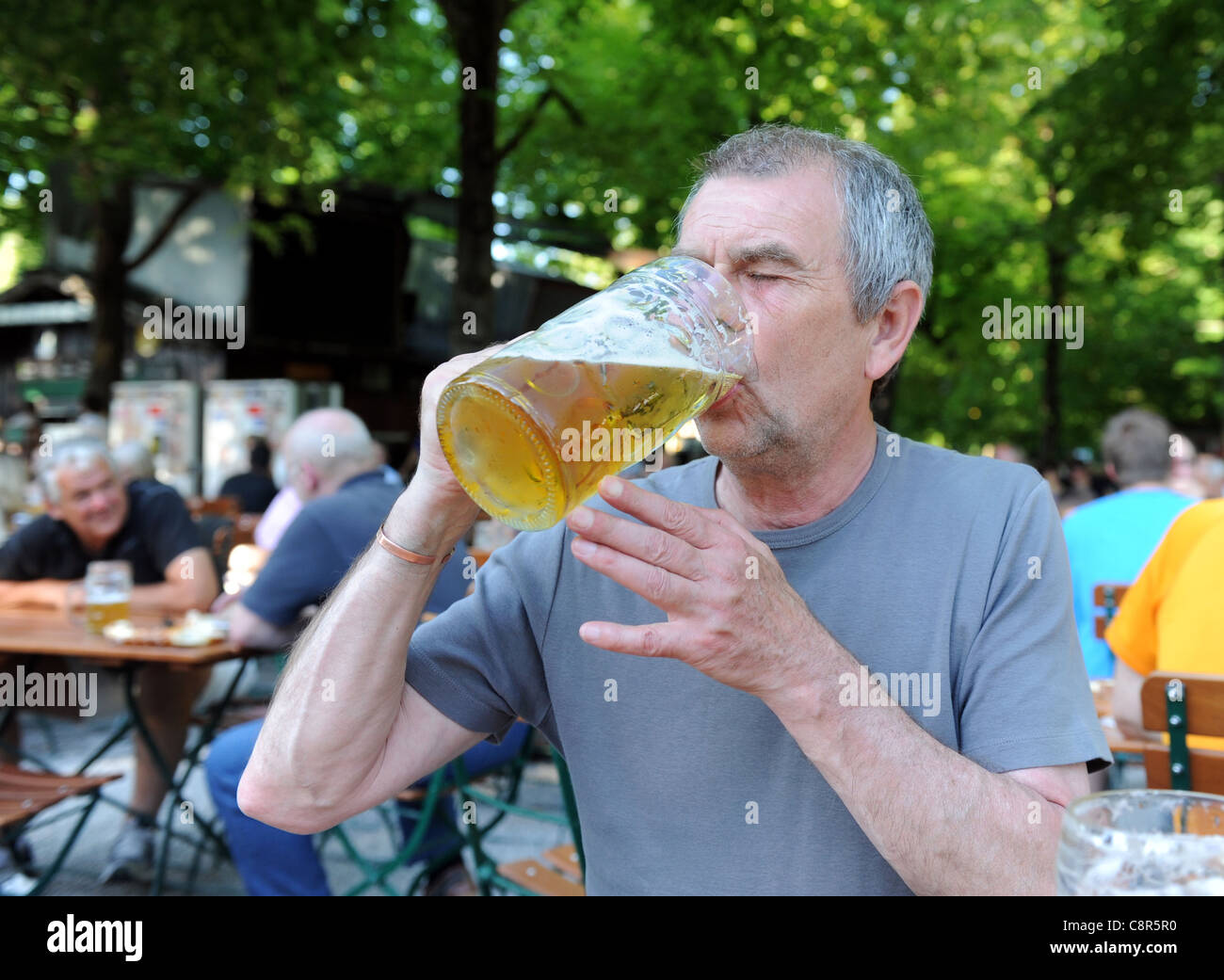 Man drinking German beer Munich Bavaria Germany Munchen Deutschland Stock Photo