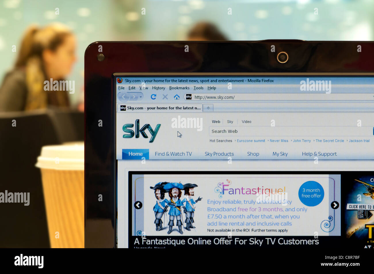 The Sky website shot in a coffee shop environment (Editorial use only: print, TV, e-book and editorial website). Stock Photo