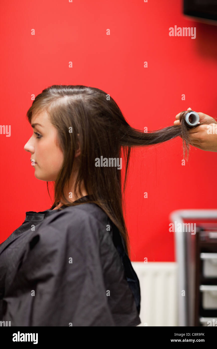 Portrait of hands rolling hair Stock Photo