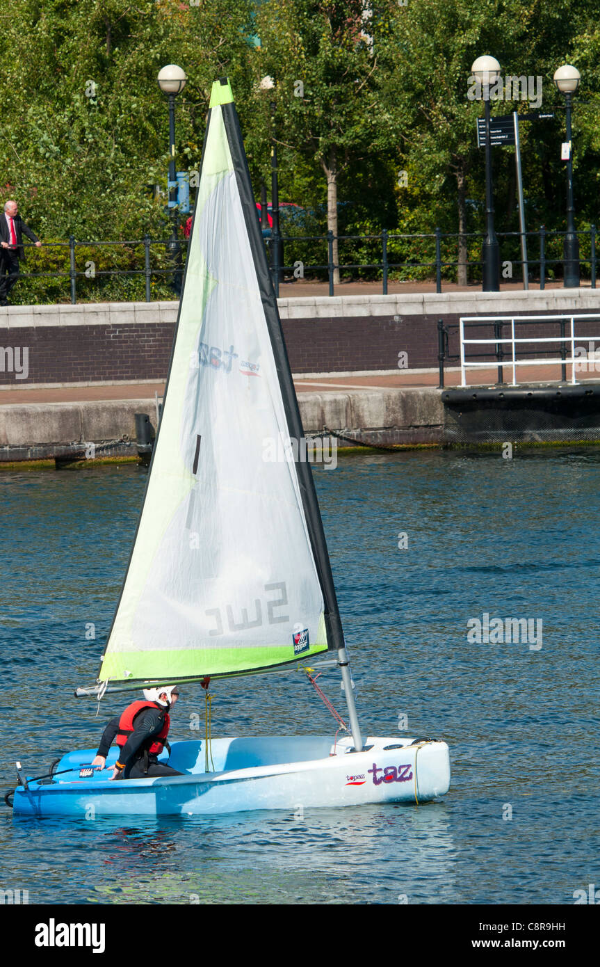 A child practicing sailing at the Watersports Centre, Salford Quays, Manchester, England, UK Stock Photo
