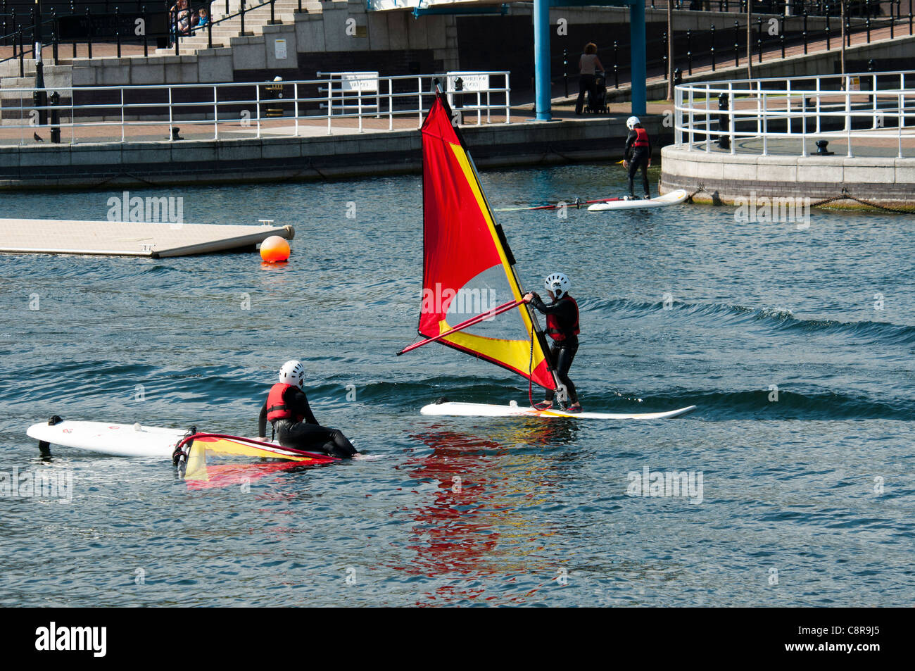 Children practicing windsurfing at the Watersports Centre, Salford Quays, Manchester, England, UK Stock Photo