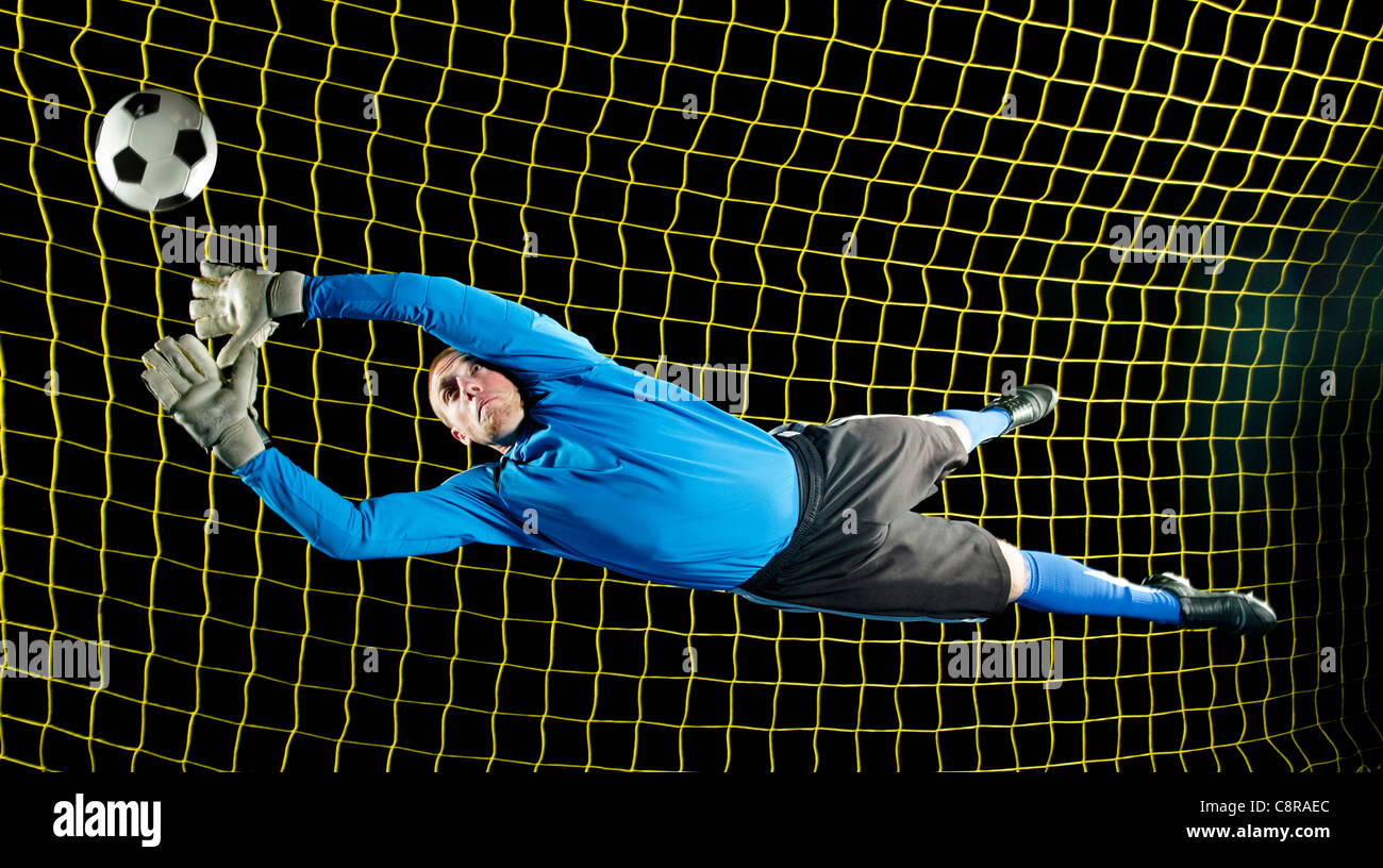 Soccer goalie jumping hi-res stock photography and images - Alamy