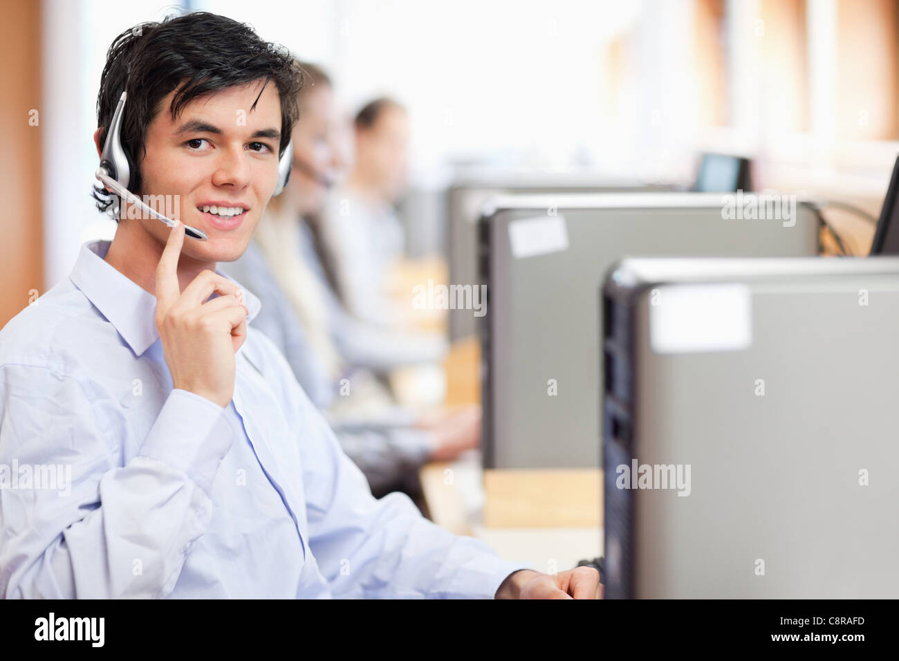 Operator posing with a headset Stock Photo - Alamy