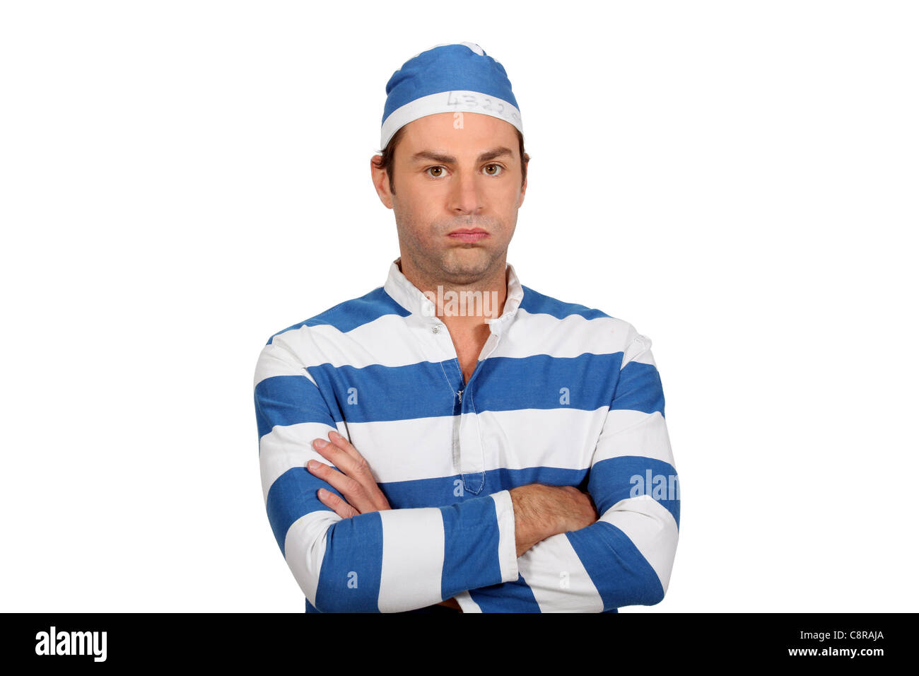Man in stripy jumper wearing matching hat Stock Photo