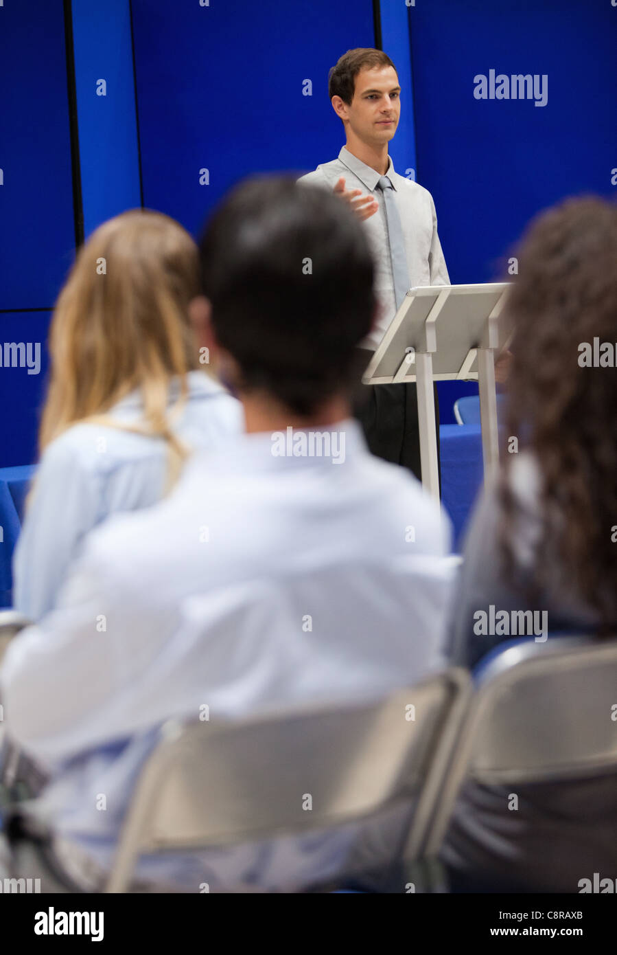 Portrait of a young man doing a presentation Stock Photo - Alamy