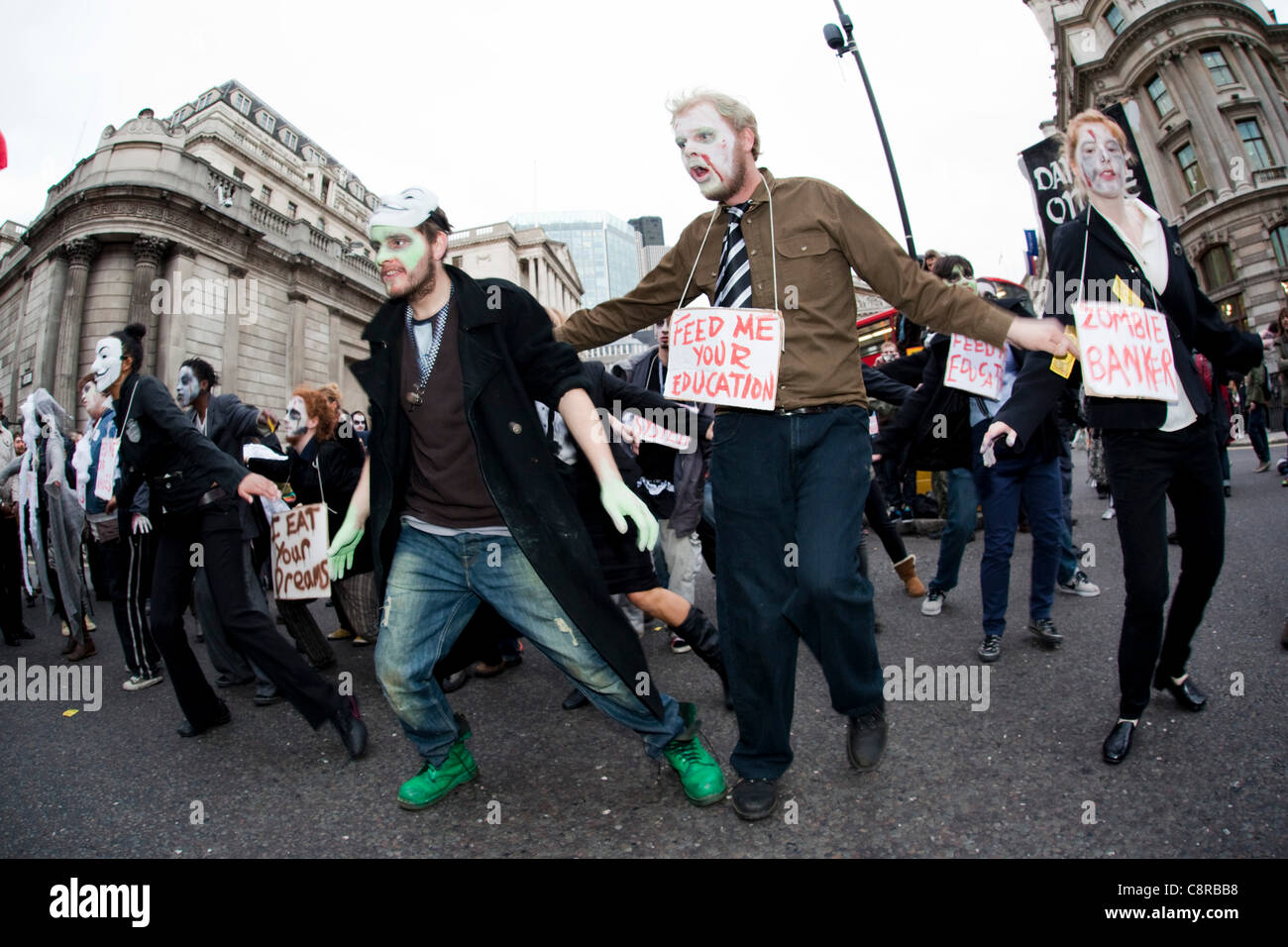 31 October 2011, London, UK. Around 50 Zombies dressed as 'Bankers' marched through the City of London on Halloween. Outside the Bank of England they stopped and danced to Michael Jackson's Thriller. Stock Photo