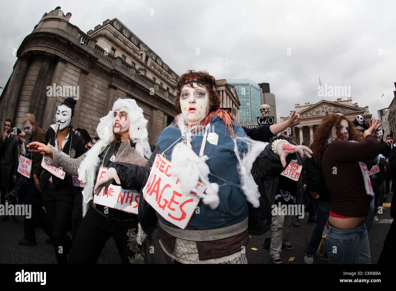 31 October 2011, London, UK. Around 50 Zombies dressed as 'Bankers' marched through the City of London on Halloween. Outside the Bank of England they stopped and danced to Michael Jackson's Thriller. Stock Photo