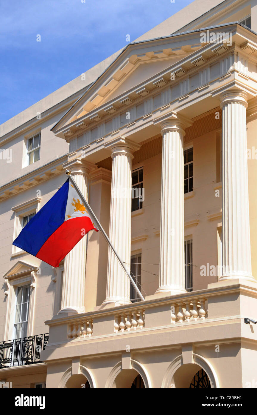 Colonnade at Philippine ambassadors embassy building & national flag London England UK Stock Photo