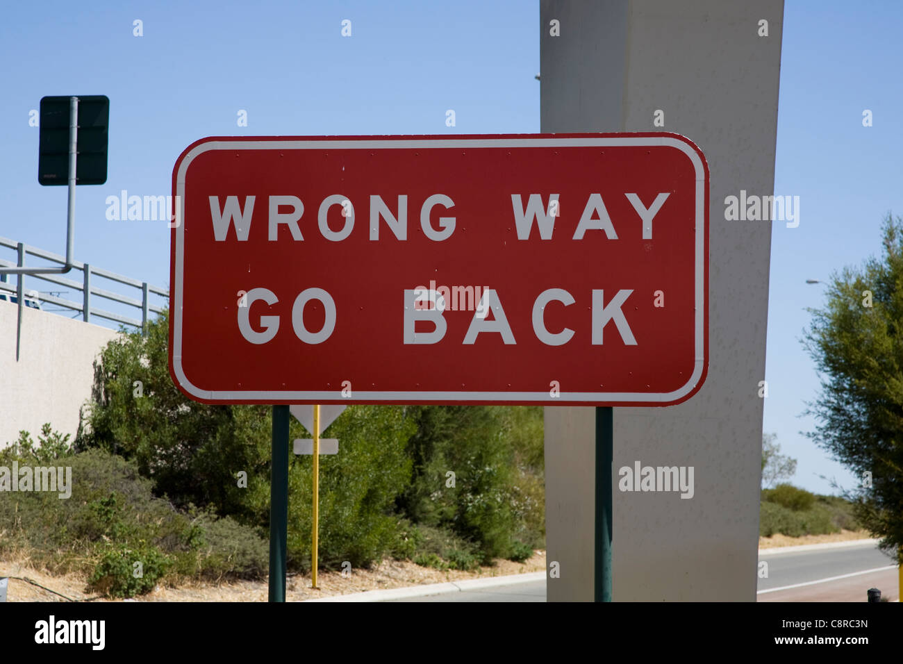 Wrong way go back roadsign Stock Photo