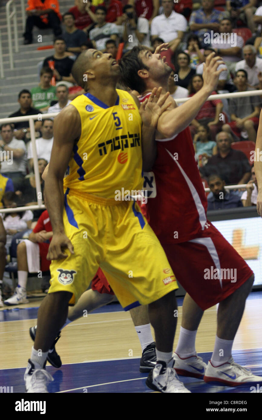 Maccabi Tel Aviv Basketball team (Yellow) Playing Hapoel Gilboa-Galil (Red)  on October 16th 2011 Stock Photo - Alamy