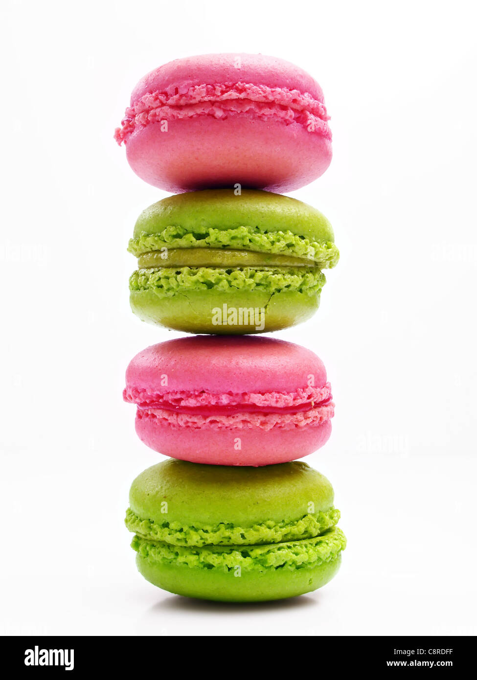 stack of strawberry and pistachio macaroons Stock Photo