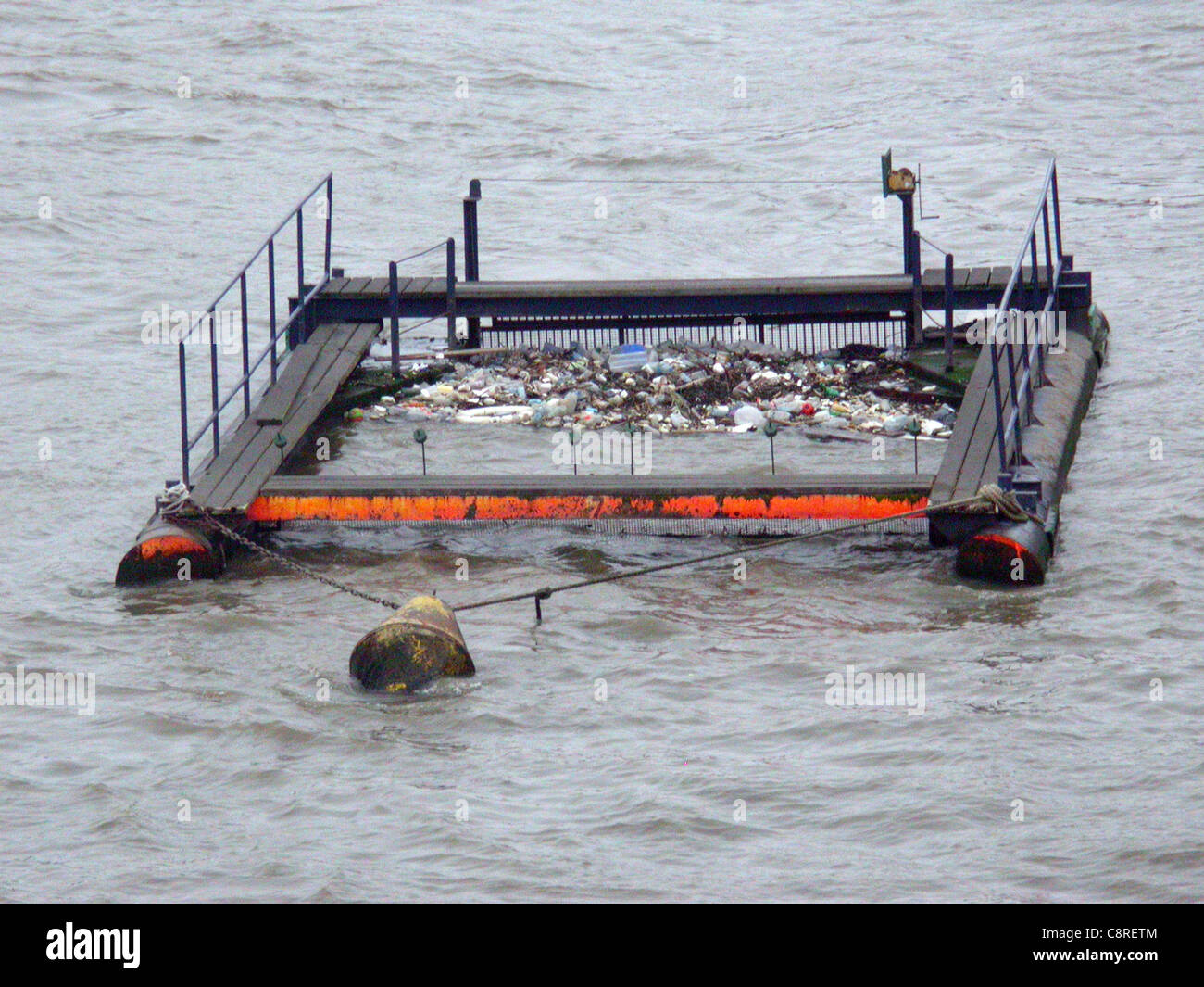 Floating bin on the river Thames, a rubbish collector launched to clear