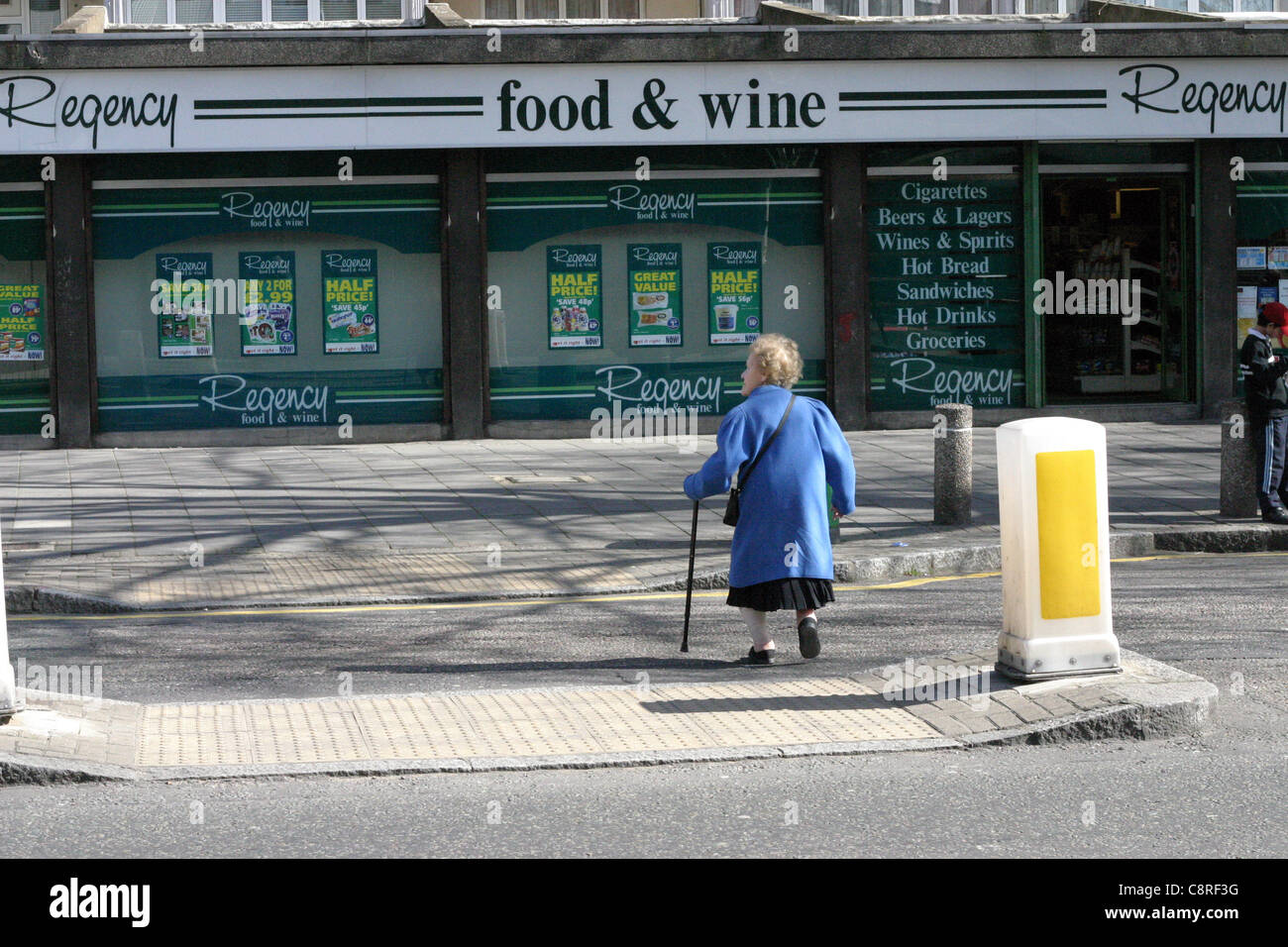 Old woman walking stick crossing hi-res stock photography and images ...