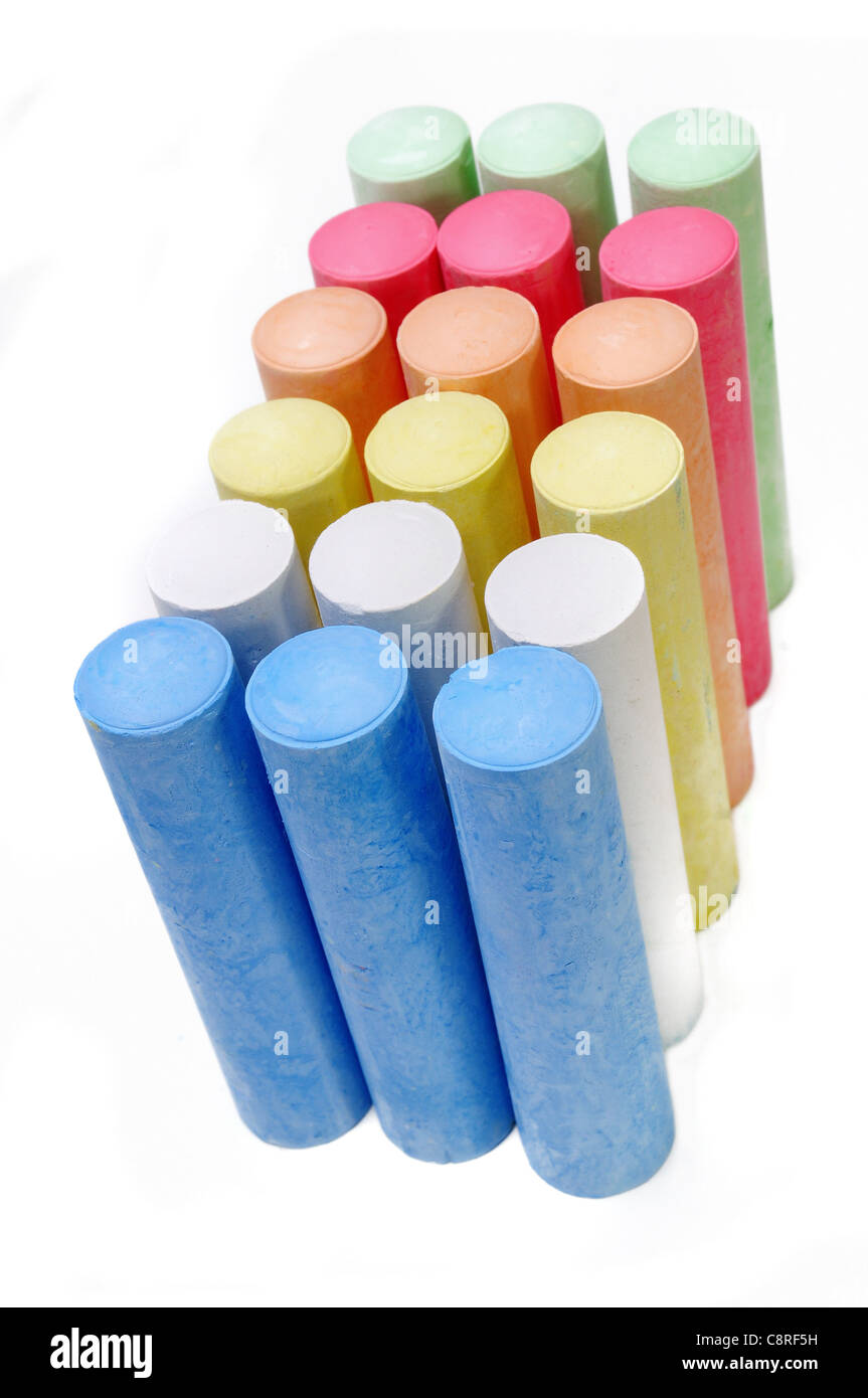 Multicolored chalk sticks over white background Stock Photo