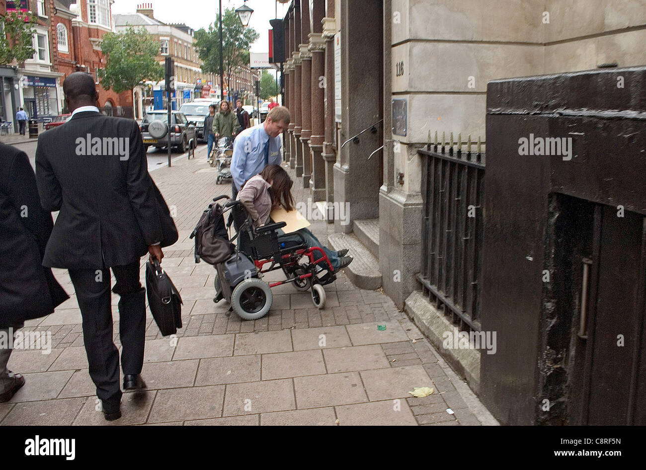 Wheelchair at foot of stairs hi-res stock photography and images - Alamy