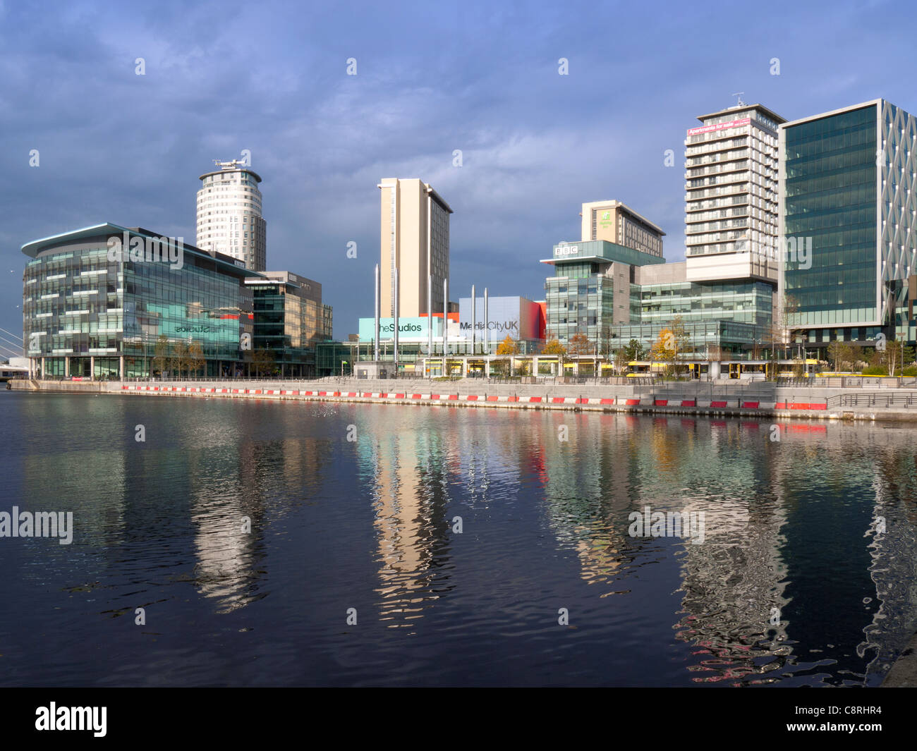 MediaCity, Salford Quays, Manchester across water, with tram Stock Photo