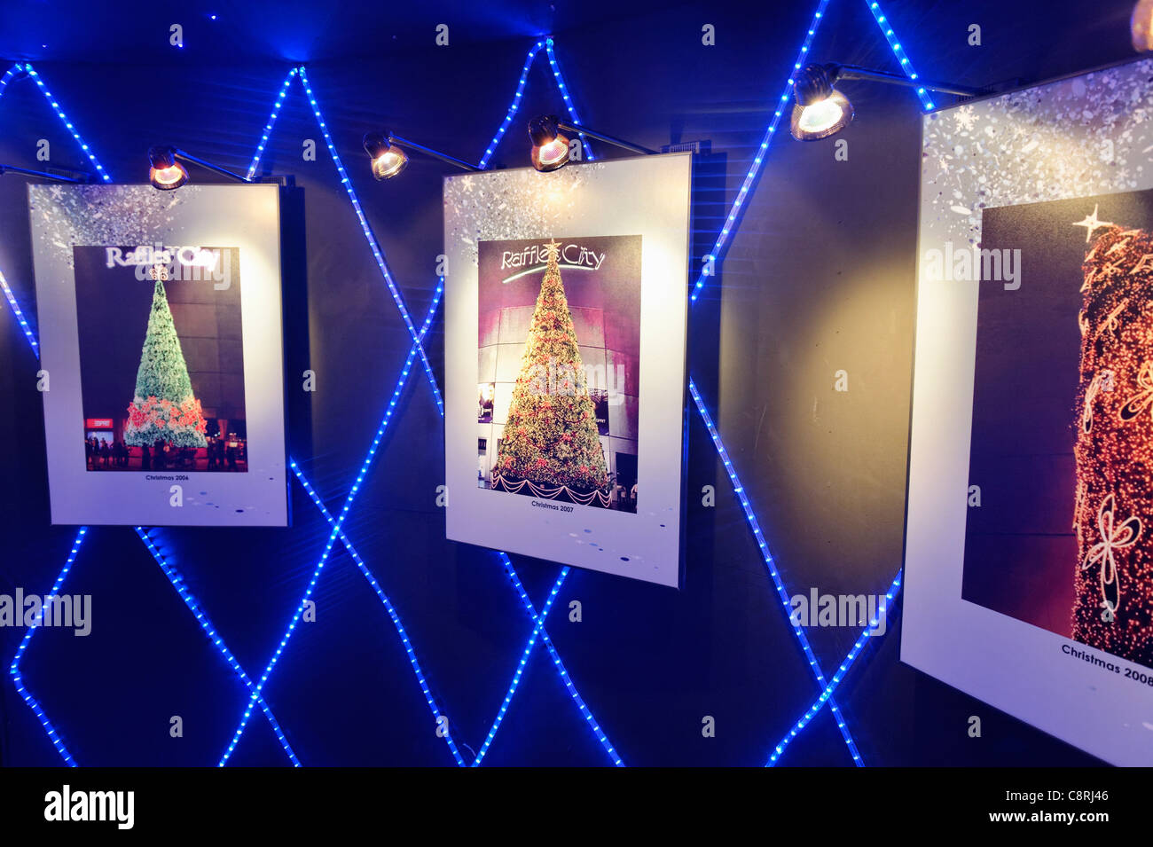 Exhibition photos inside the Raffles City Christmas Tree of previous Raffles City Christmas trees/ Stock Photo