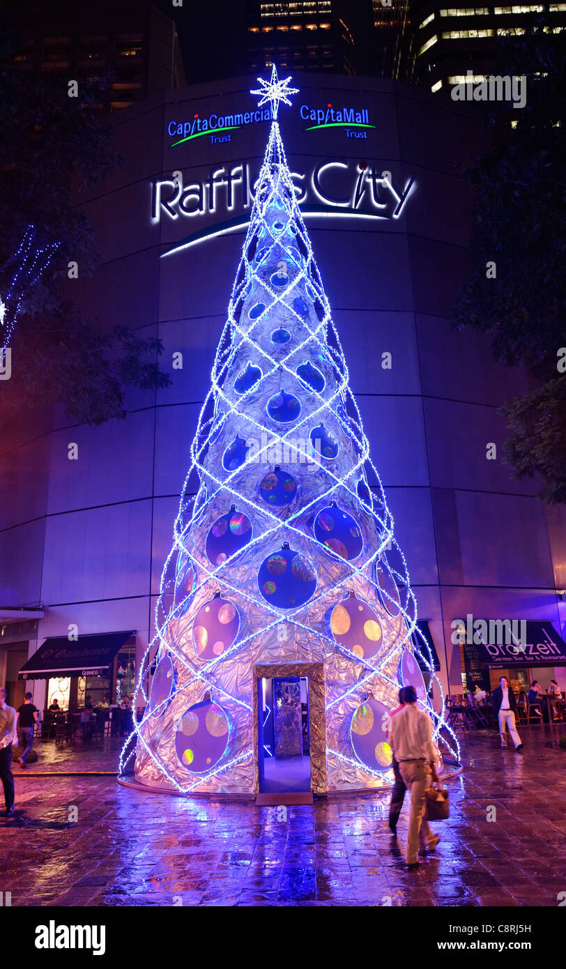 Christmas tree outside Raffles City shopping mall, City Hall, Singapore. Stock Photo