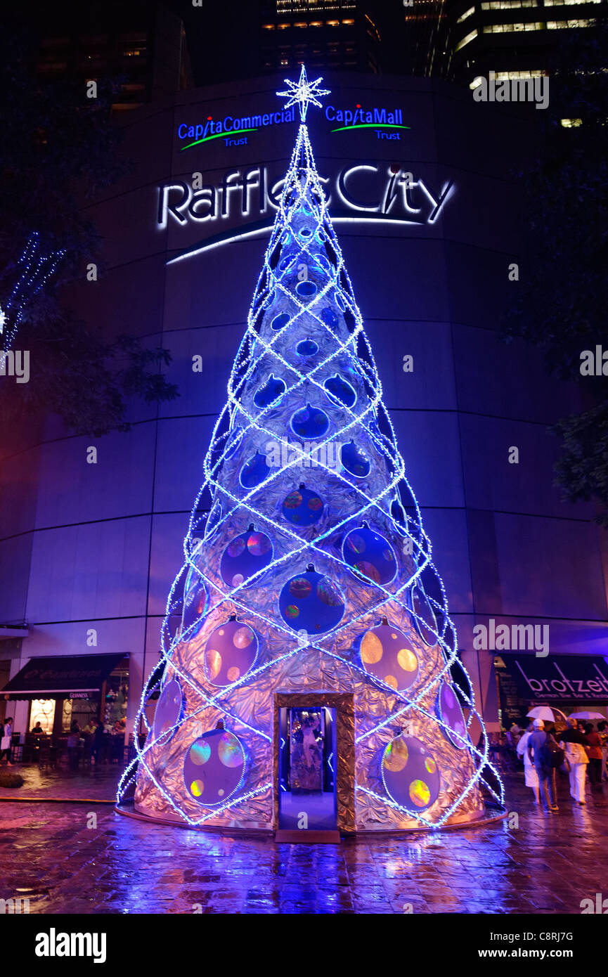 Christmas tree outside Raffles City shopping mall, City Hall, Singapore. Stock Photo