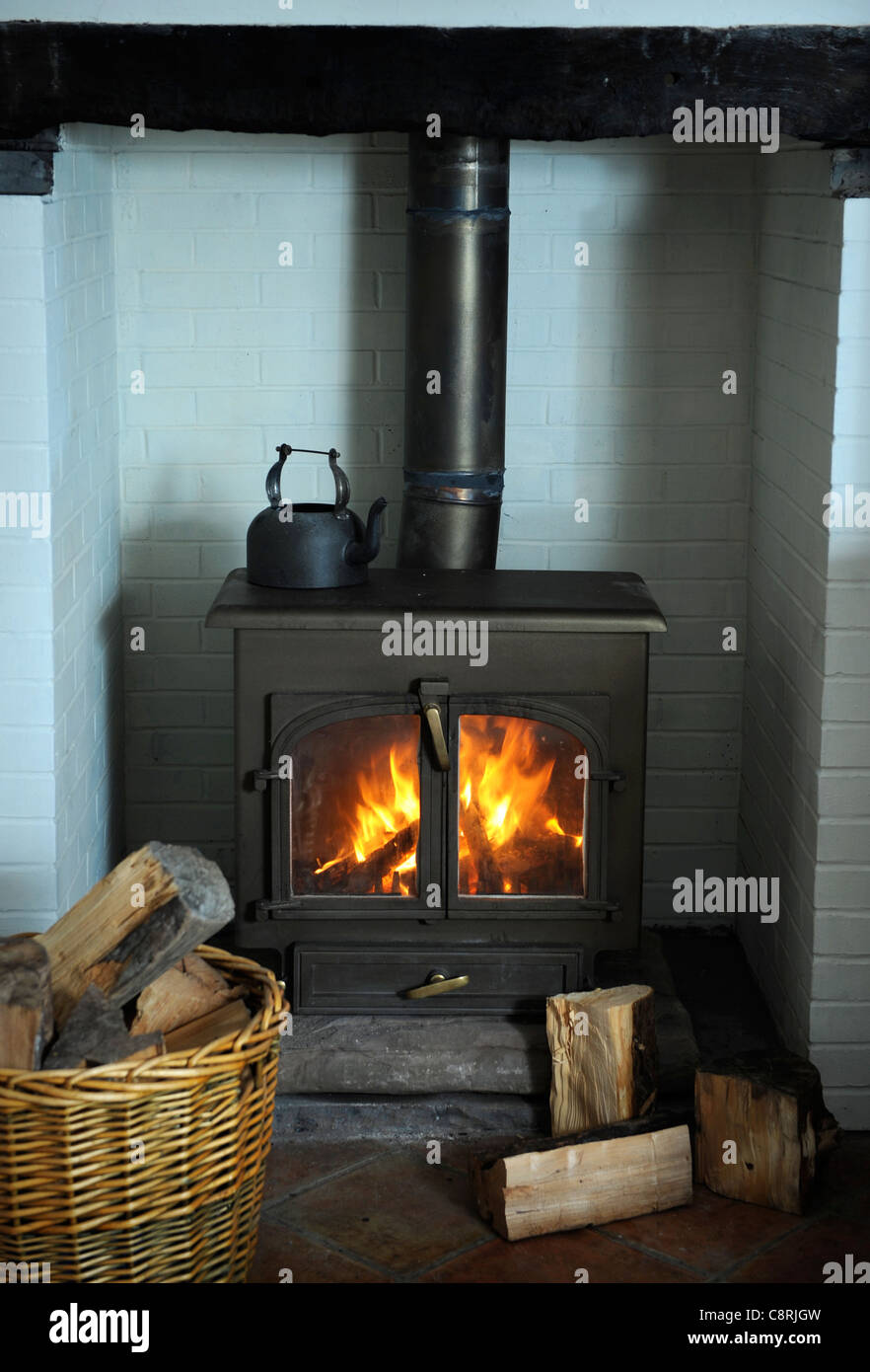 A solid fuel wood burning stove heating a home UK Stock Photo Alamy