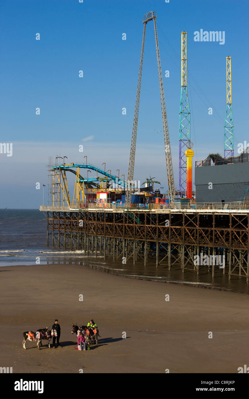 Blackpool's South Pier with donkey rides on the beach Stock Photo