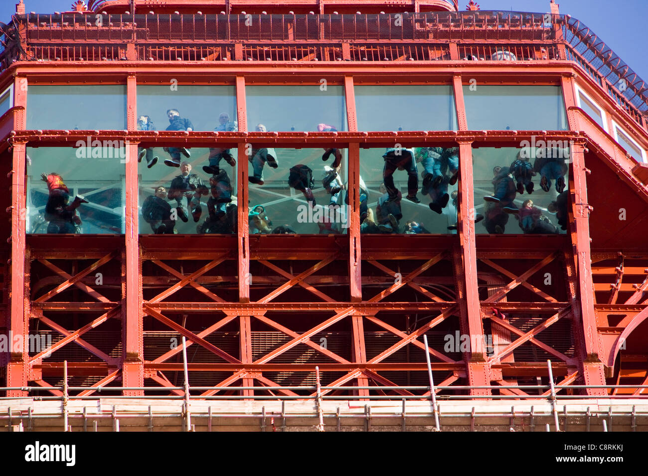 People walking on the glass floor skywalk of The Blackpool Eye, part of the Blackpool Tower in Blackpool, UK Stock Photo