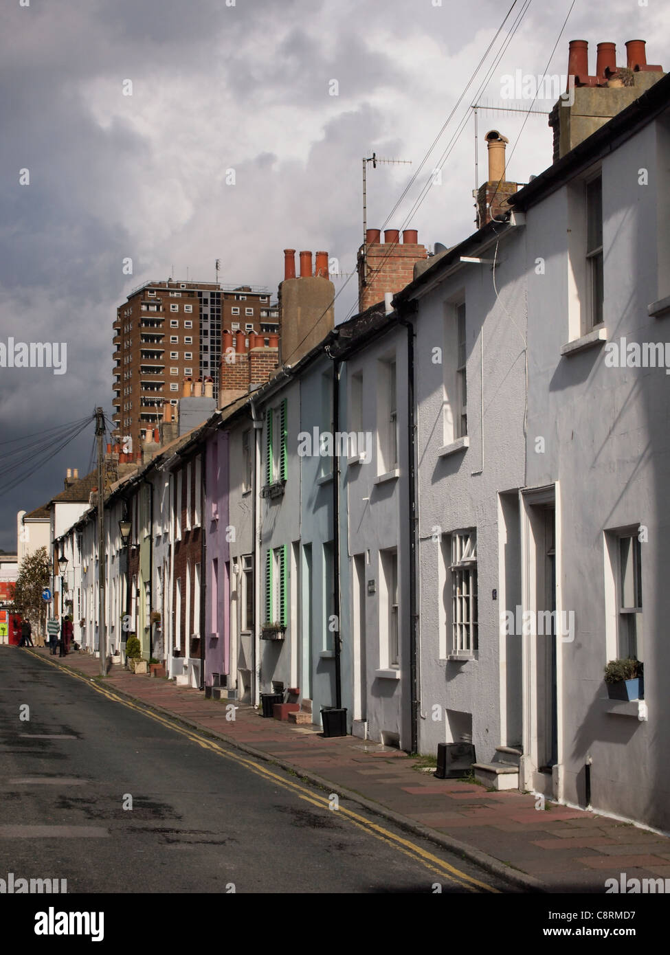 Brighton stormy brooding sky flats houses row dark street hires stock