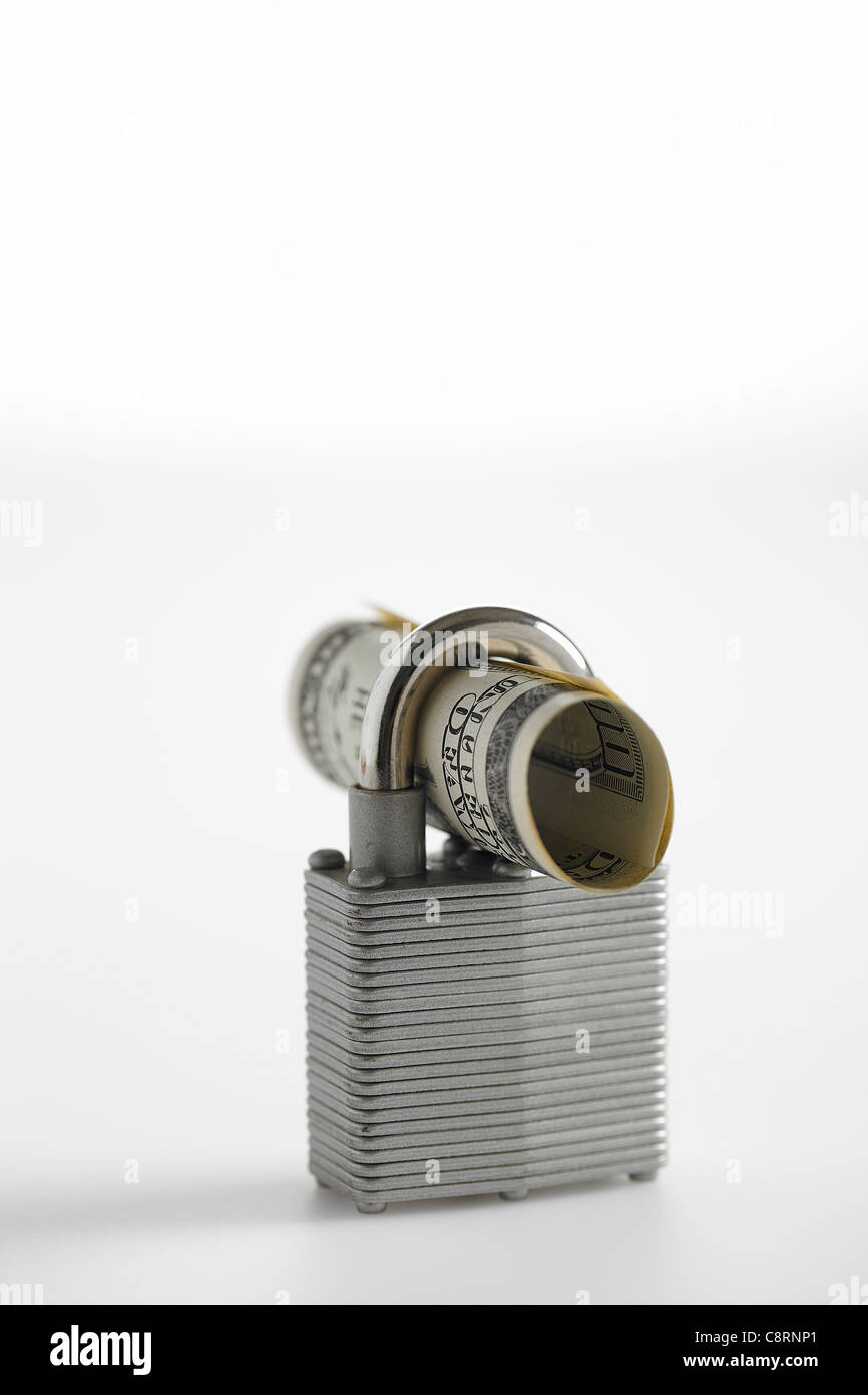 Roled Note Rolled currency note and a padlock Stock Photo - Alamy