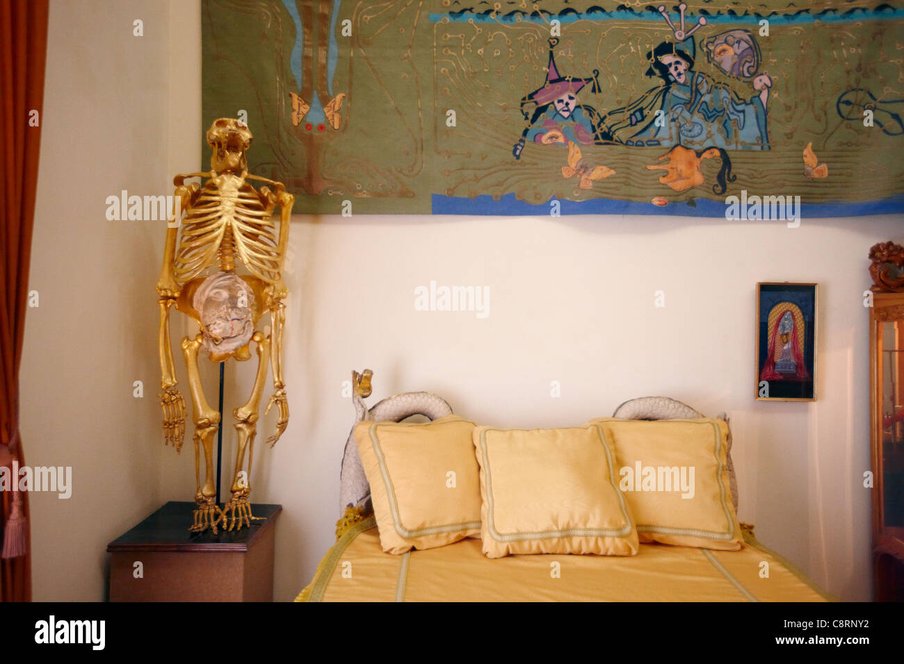 Gold-plated orangutan skeleton on a bedside table in the Palace of the Wind Room. Theatre-Museum of Salvador Dali, Figueres, Catalonia, Spain. Stock Photo