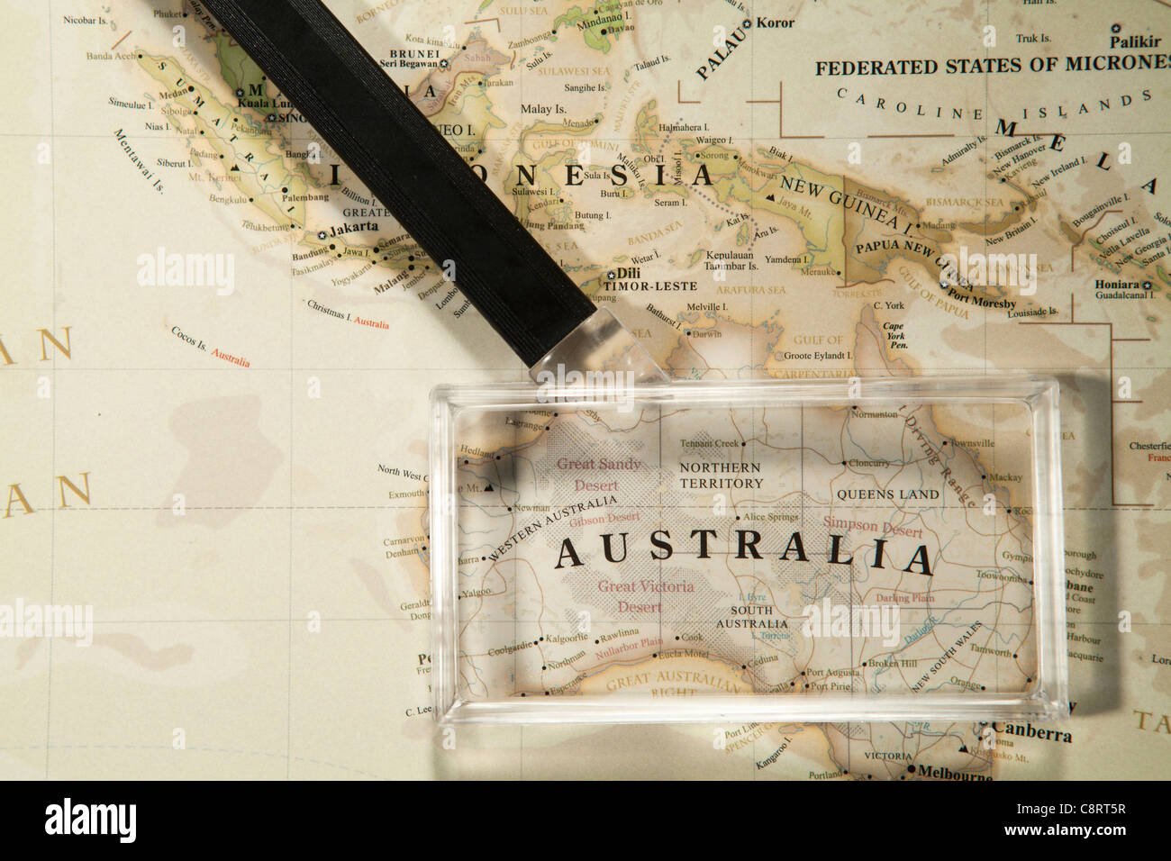 Close-up of Asian continent world map with magnifying glass Stock Photo