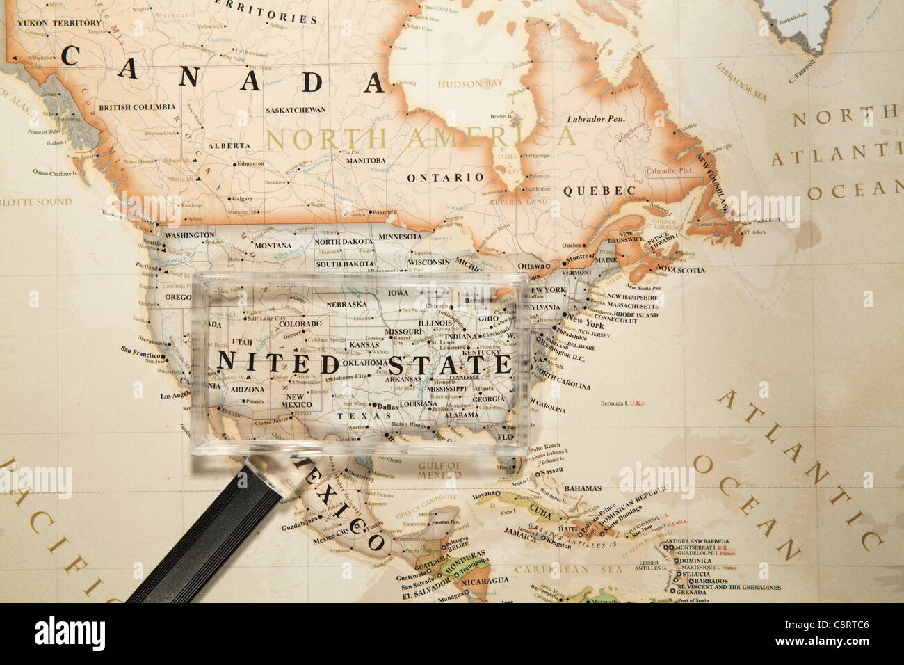 Close-up of North American continent world map with magnifying glass Stock Photo