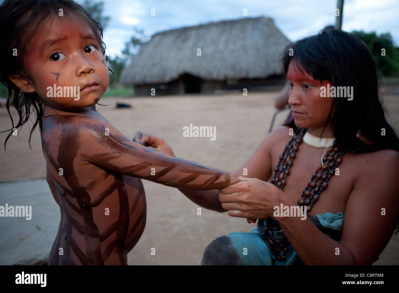 Xingu indians paint their body, Amazone, Brazil Stock Photo