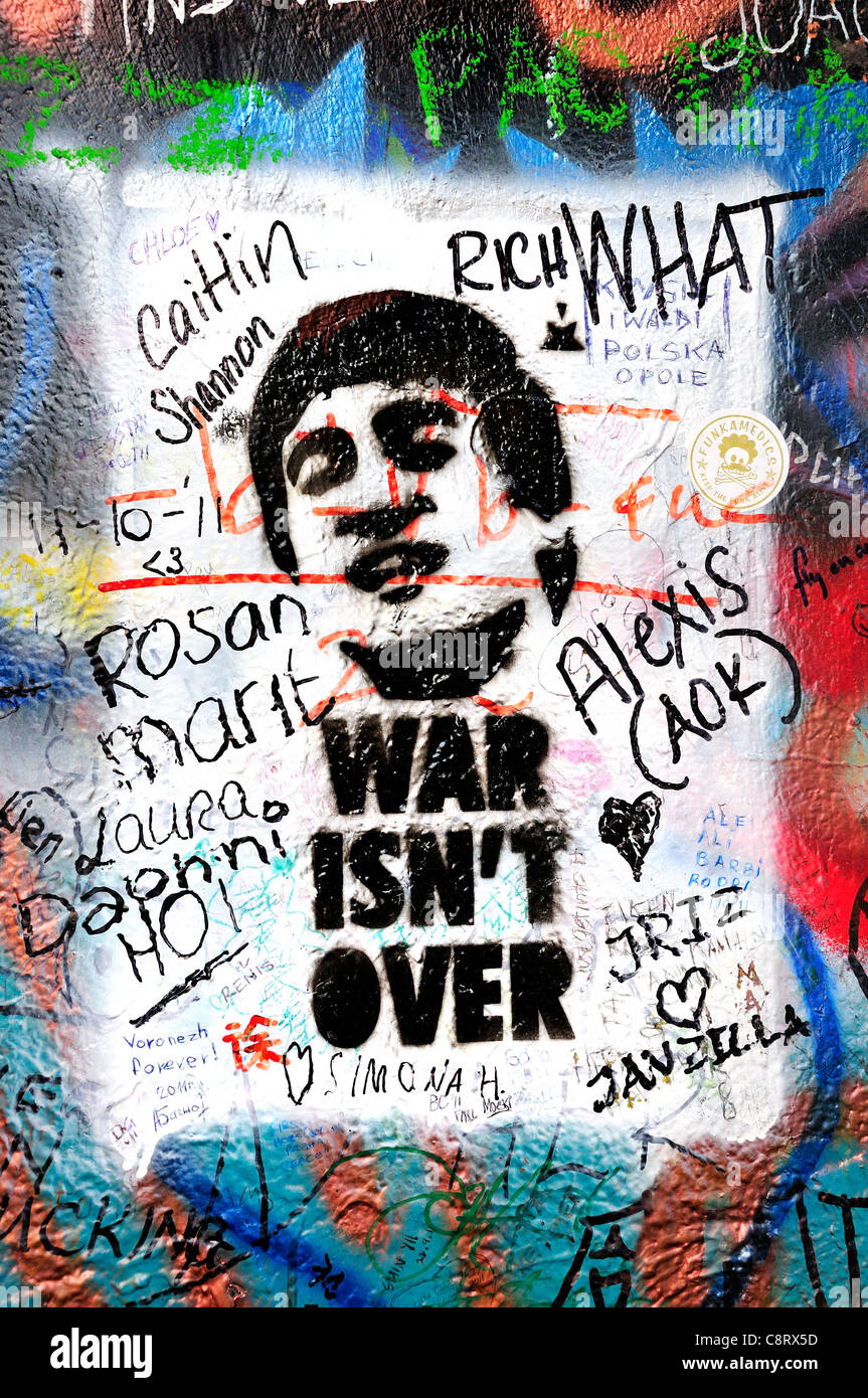 Prague, Czech Republic. Mala strana. John Lennon Wall in Velkoprevorske namesti (square) 'War isn't over' Stock Photo